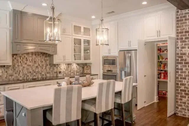 Primary suite interior of Plan 51814HZ featuring a vaulted ceiling, shiplap accent wall behind the bed, large windows overlooking the rear yard, and wide-plank hardwood flooring