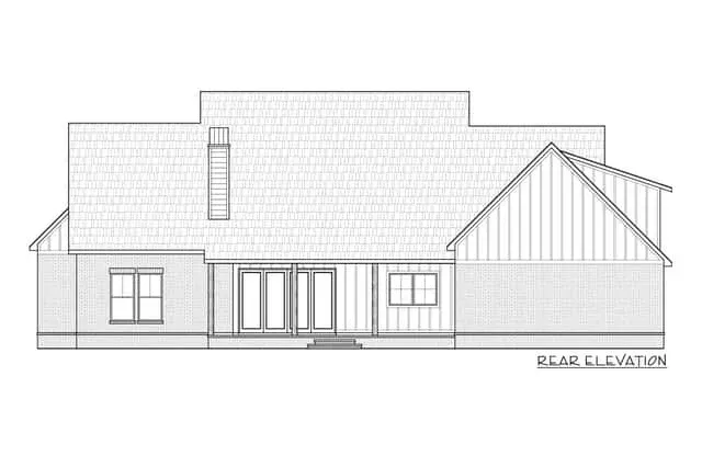 Overall context view of the modern farmhouse sited on a half-acre lot with front-yard landscaping, flagstone pathway, and circular gravel drive turnaround