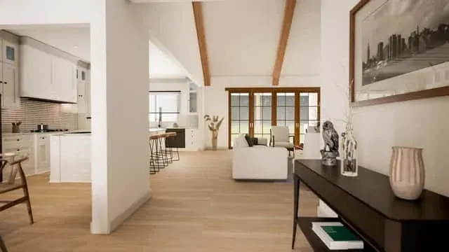Secondary bedroom with vaulted ceiling option, neutral bedding, and sliding-barn-door access to the Jack-and-Jill bathroom