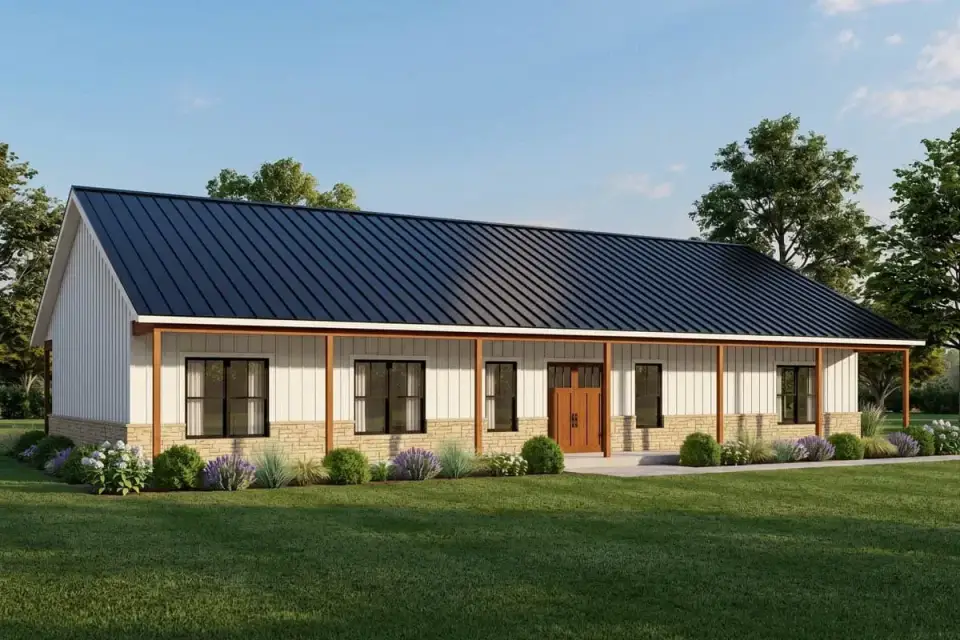 Front exterior of the barndominium farmhouse with standing-seam metal roof and full-width porch