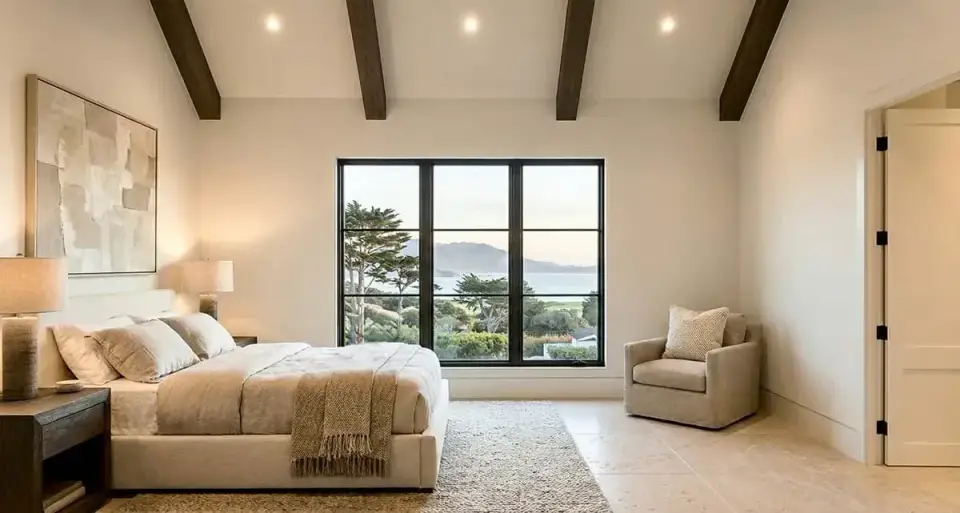Dining area open to kitchen and great room with vaulted ceiling and pendant lighting