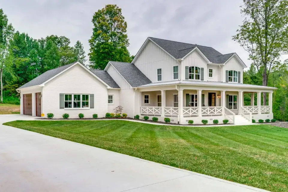 Expanded modern farmhouse 2796 sq ft front elevation with wraparound porch, gabled dormers, and side-load 3-car garage