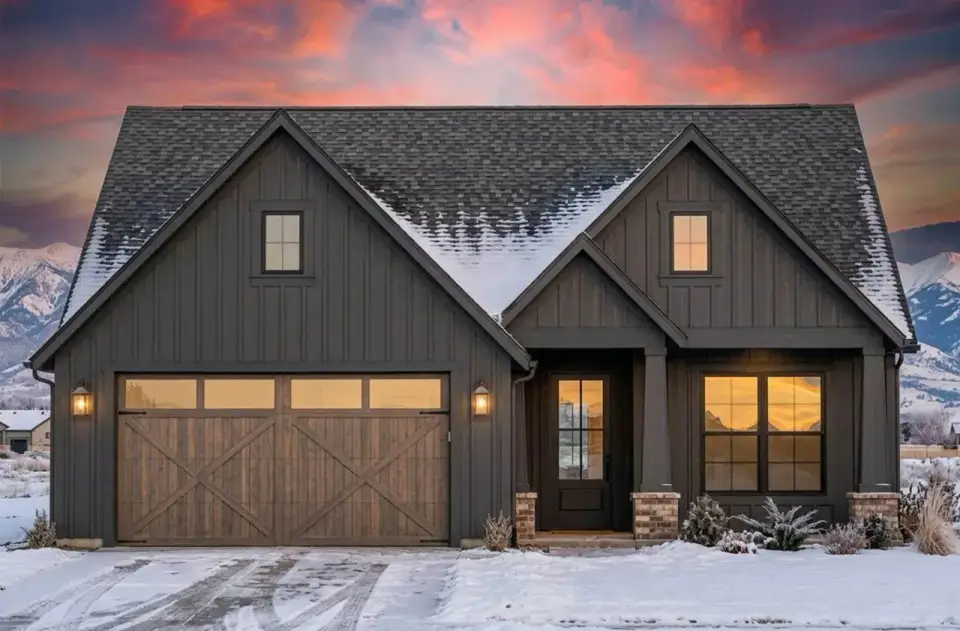 Rear elevation showing the covered back porch, large slider opening from the dining area to the porch, and primary bedroom windows