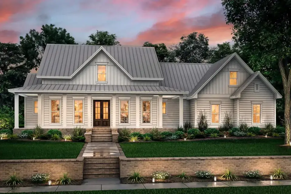 Close-up of front entry with wood door sidelights transom and flanking gas lantern sconces