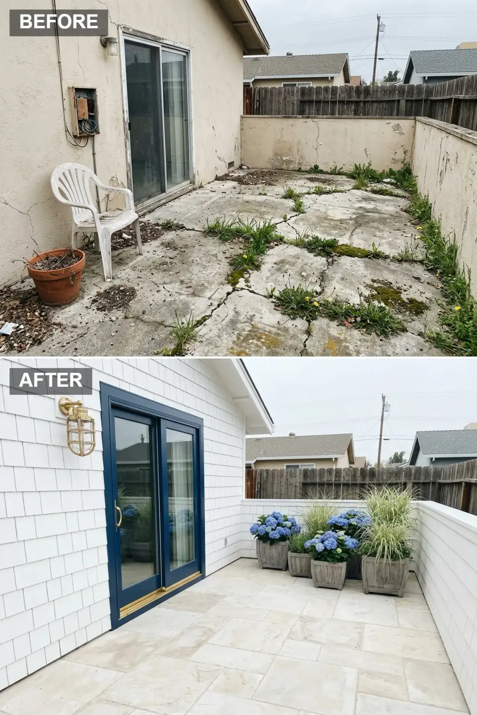 Coastal cottage side yard renovation with crisp white shingle siding, navy blue sliding door with brass hardware, brass nautical sconce, large-format creamy travertine tile flooring, weathered gray wooden planters with blue hydrangeas and variegated grasses