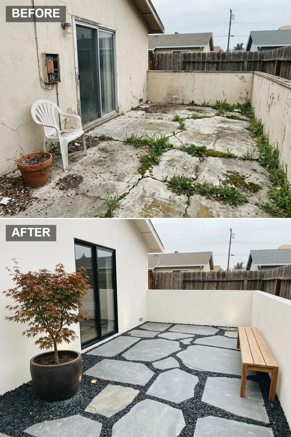 Zen stone side yard garden with irregular bluestone flagstones on bed of polished black pebbles, smooth white stucco walls, mature Japanese maple in charcoal ceramic pot, slatted cedar bench, minimalist black-framed glass door, in-ground LED uplights