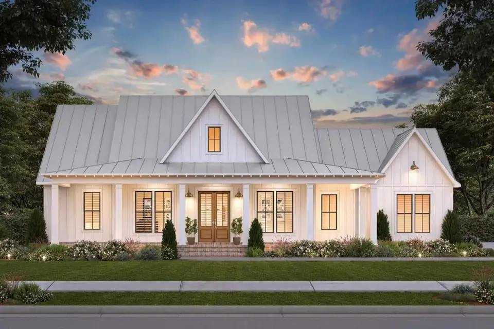Front elevation of 2085 sq ft single-story modern farmhouse with ribbed metal roof, board-and-batten siding, stone veneer chimney and wraparound porch with timber beam detail