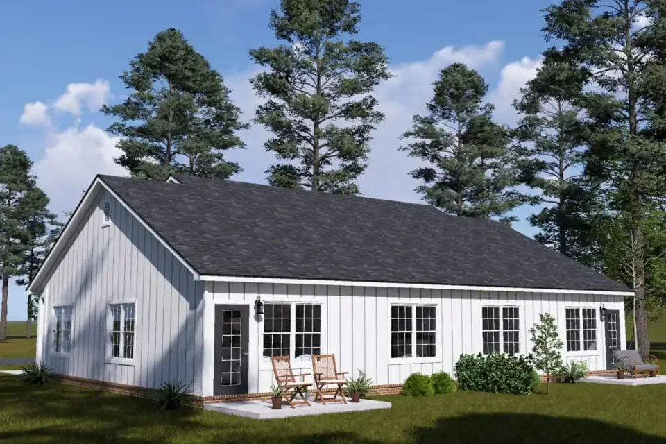 Plan 52532WM dusk exterior modern ranch duplex with warm interior lighting glowing through black framed great room windows and porch lighting accents