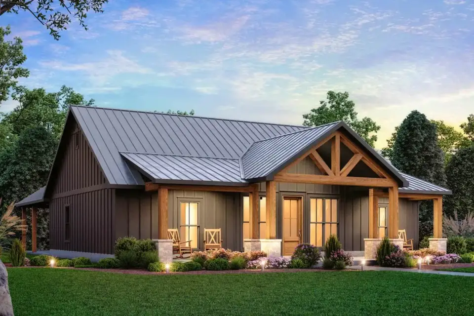 Angled view of modern farmhouse showing front gable with timber trusses and deep covered porch