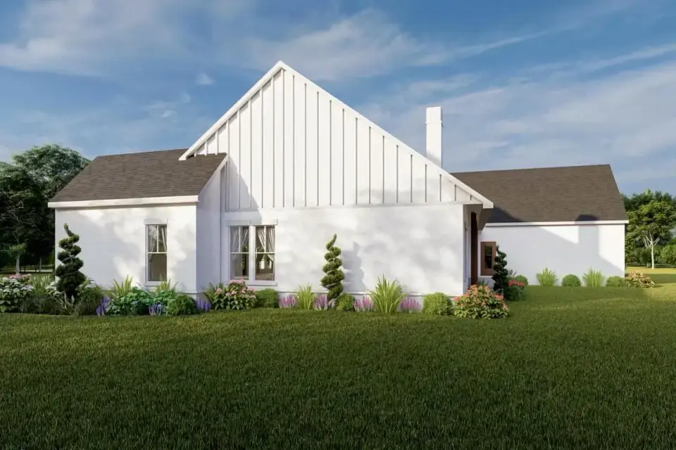 Three-car side-entry garage with matching board-and-batten siding, carriage-style doors, and metal roof accent over the mudroom entry