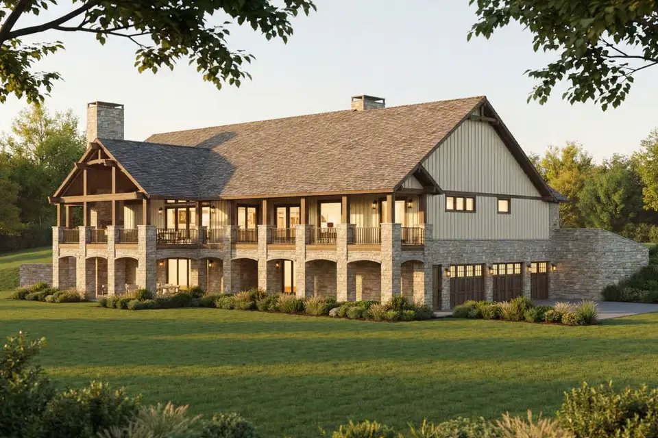 Angled front view of plan 70966MK showing the covered entry porch, stone chimney and side-entry garage wing