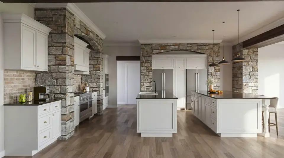Kitchen of plan 70966MK with white inset cabinetry, stone-clad range wall, double islands and wide-plank oak floors