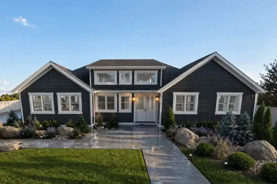 Front elevation of the modern farmhouse with board-and-batten siding and twin gables