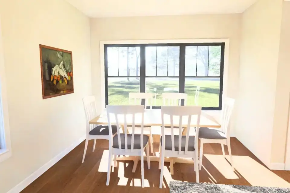 Primary bedroom with sitting area in 4-bedroom farmhouse plan 52551WM