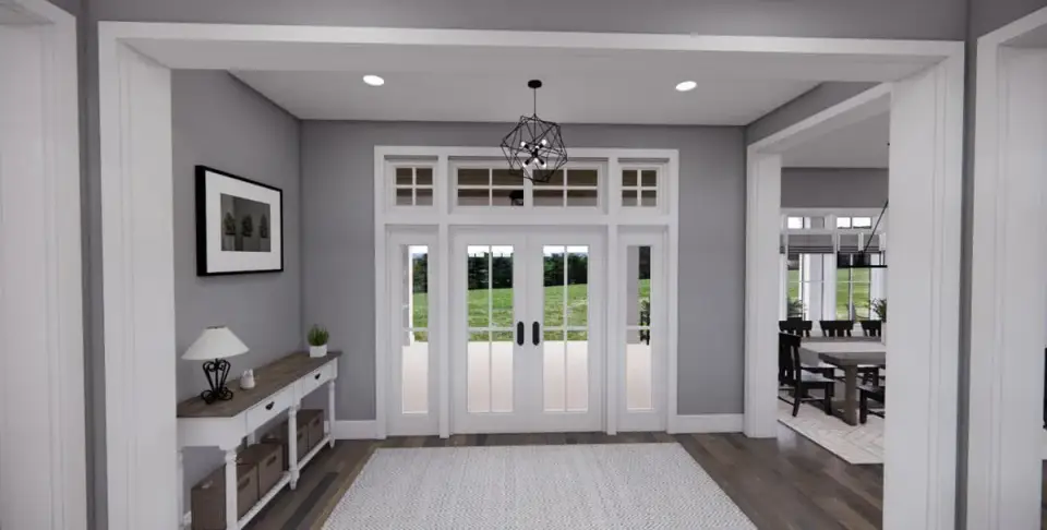 Great room interior with tray ceiling, exposed wood beams, stone veneer fireplace, and built-in cabinetry