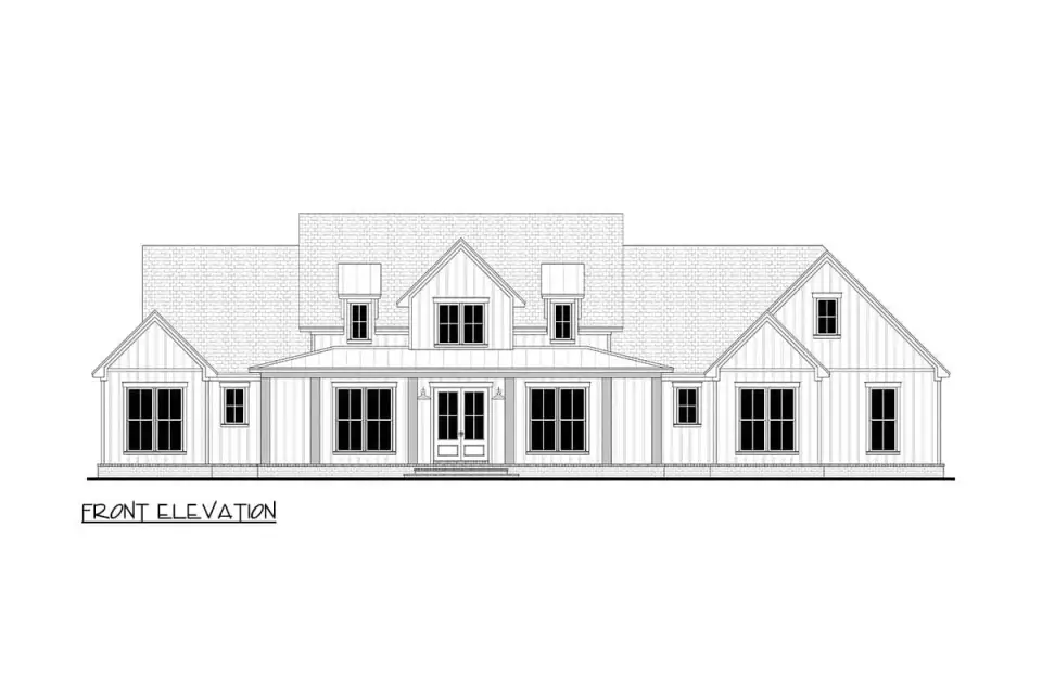Close-up of the board-and-batten siding texture, corner trim profile, and gable peak detailing characteristic of the modern farmhouse vocabulary