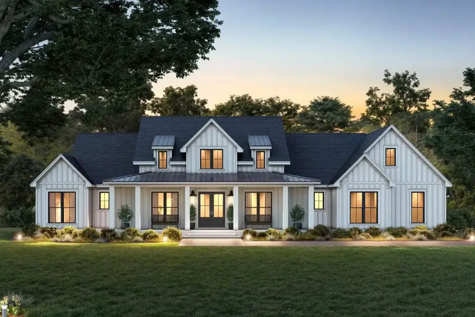 Right side elevation showing the primary suite wing, high vaulted-ceiling bedroom window, and landscaping along the property line