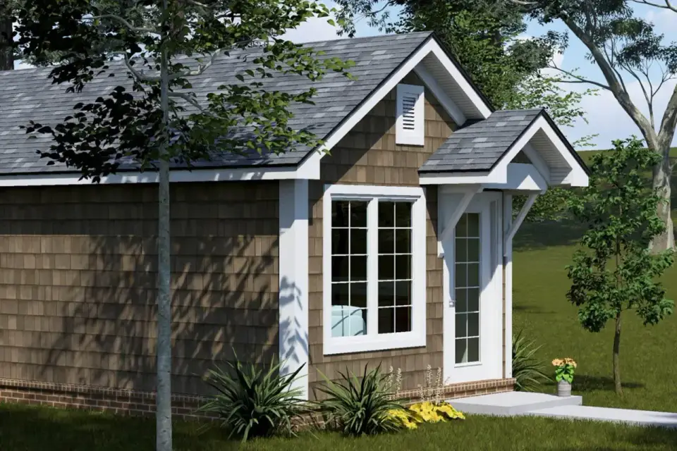 Plan 52530WM exterior detail of brick water table foundation skirt below shingle siding with white window trim