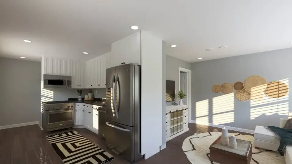 Open dining and living area with dark wood-look flooring and recessed ceiling lighting