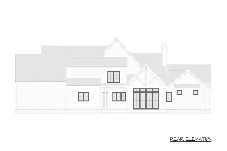 Twilight exterior view of plan 750024LDG with layered facade lighting
