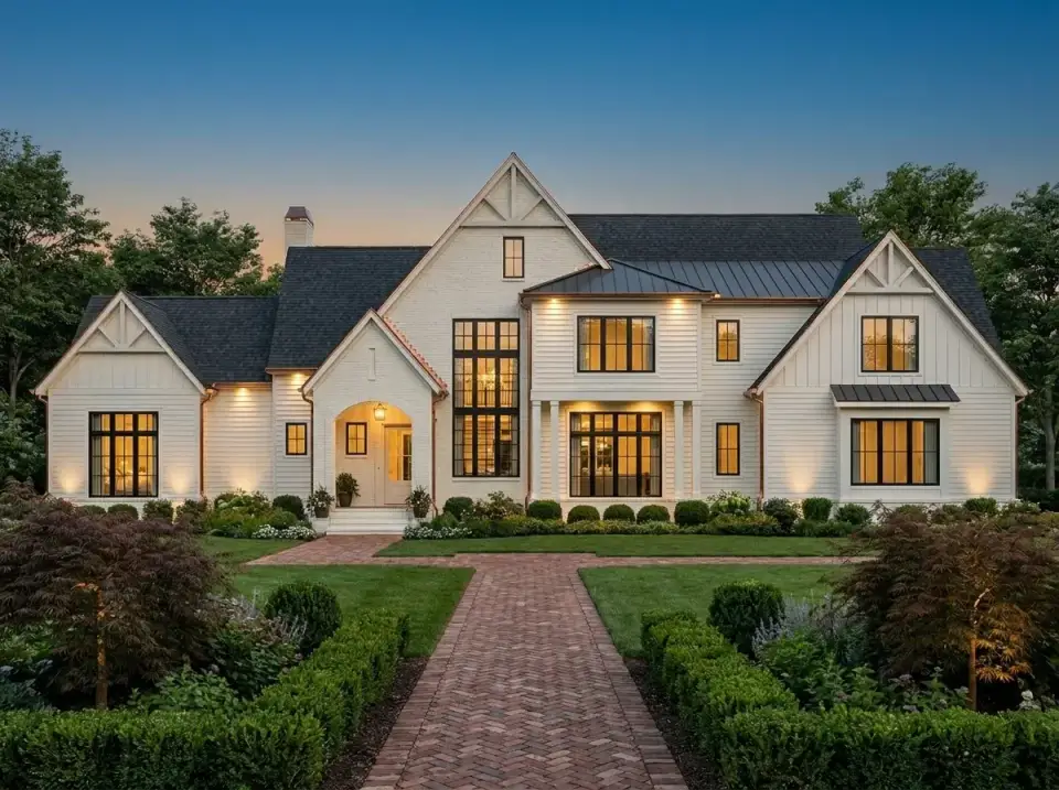 Suburban farmhouse at dusk facade of plan 750024LDG with white board-and-batten