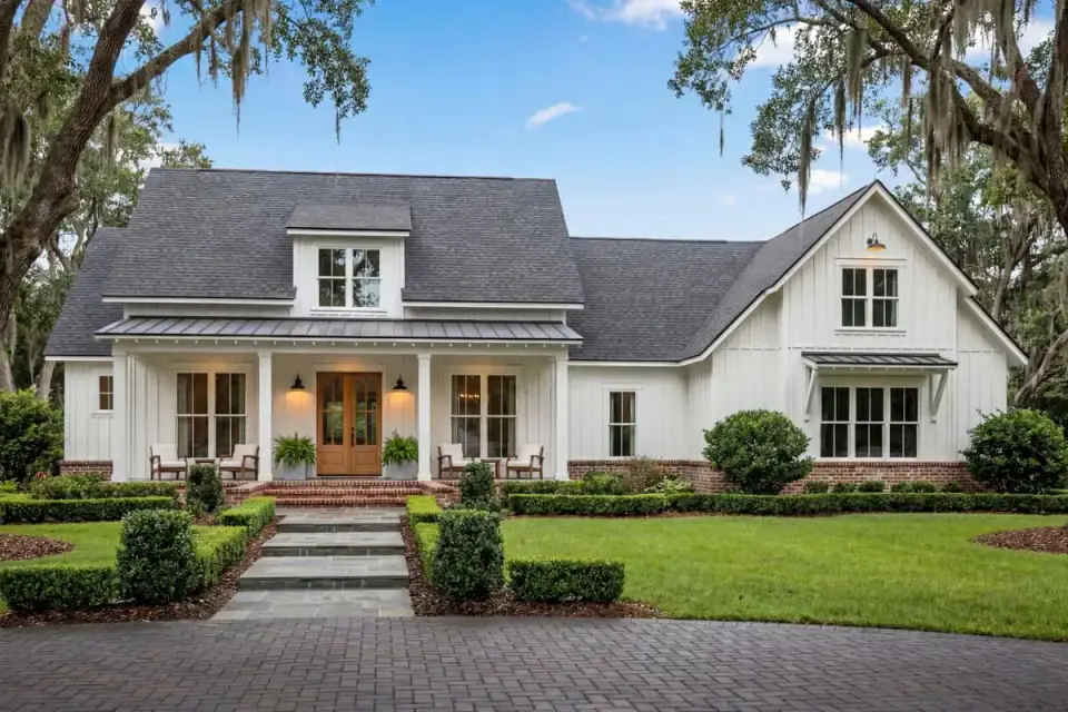 Modern farmhouse rear covered porch with outdoor living space