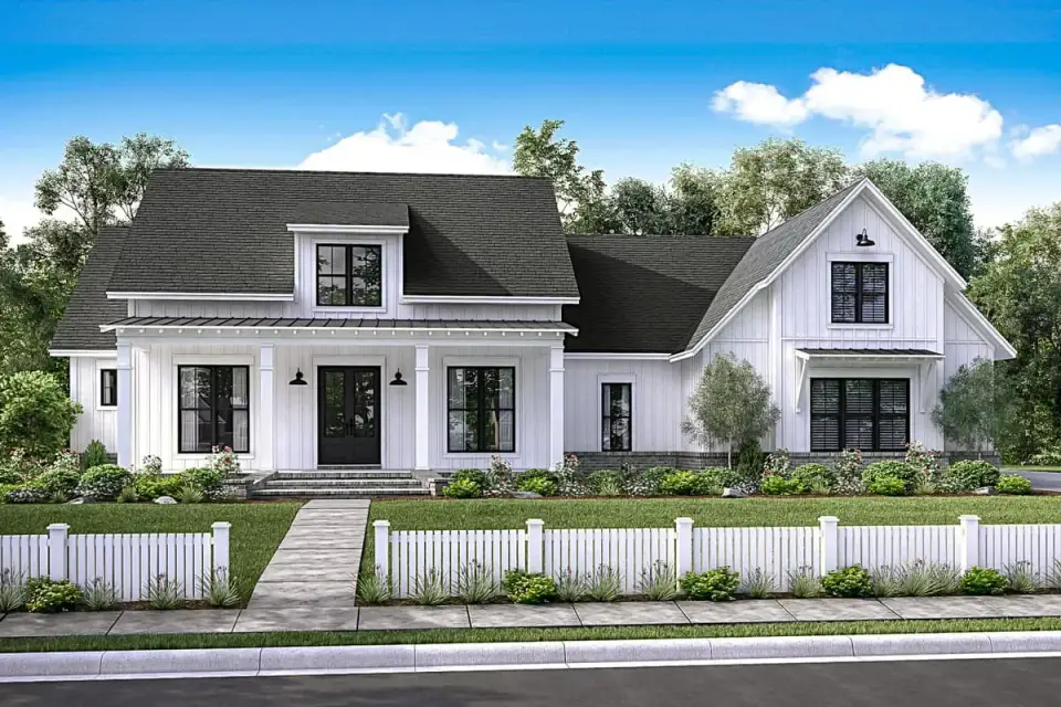 Gable rooflines and board and batten siding on single story farmhouse