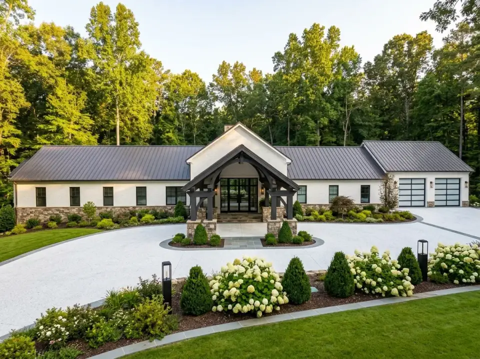 Formal modern farmhouse facade in high-contrast white with dark mullions and a circular motor court
