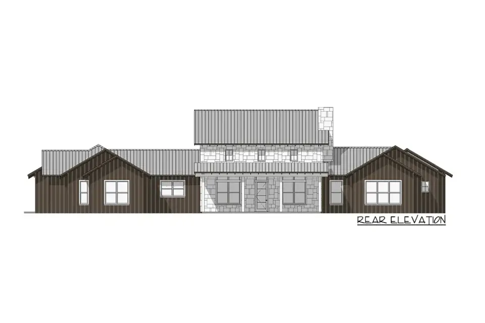 Evening exterior of single-story Modern Farmhouse plan with warm interior lighting through clerestory windows