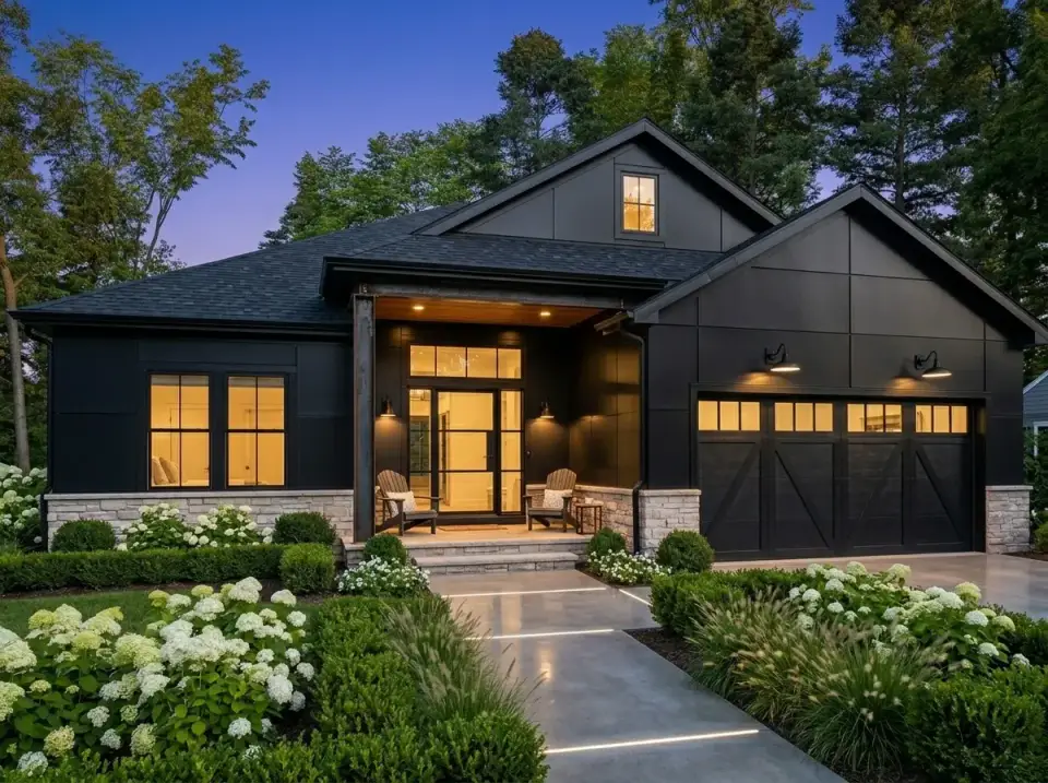 Dark Contemporary facade with matte black siding and light stone base