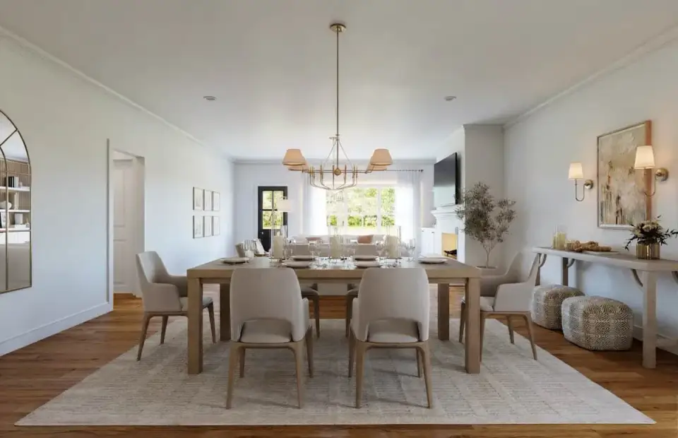 Kitchen with white shaker cabinetry, brass hardware, large center island with seating and pendant lighting on a barndominium plan