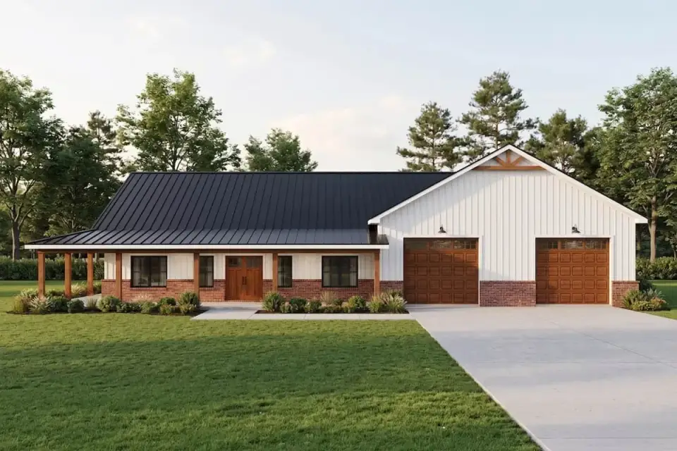 Barndominium exterior with standing-seam metal roof and covered porch on wood columns
