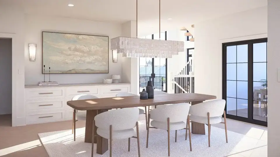 Open-concept kitchen with large island, shaker cabinetry, stone countertops, and open shelving in coastal contemporary plan