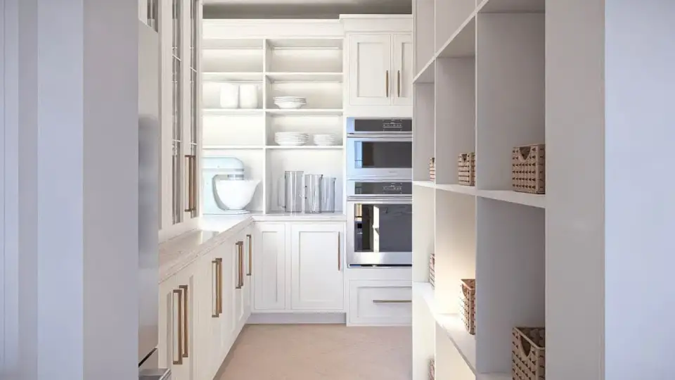 Dining zone open to kitchen with large windows framing coastal view