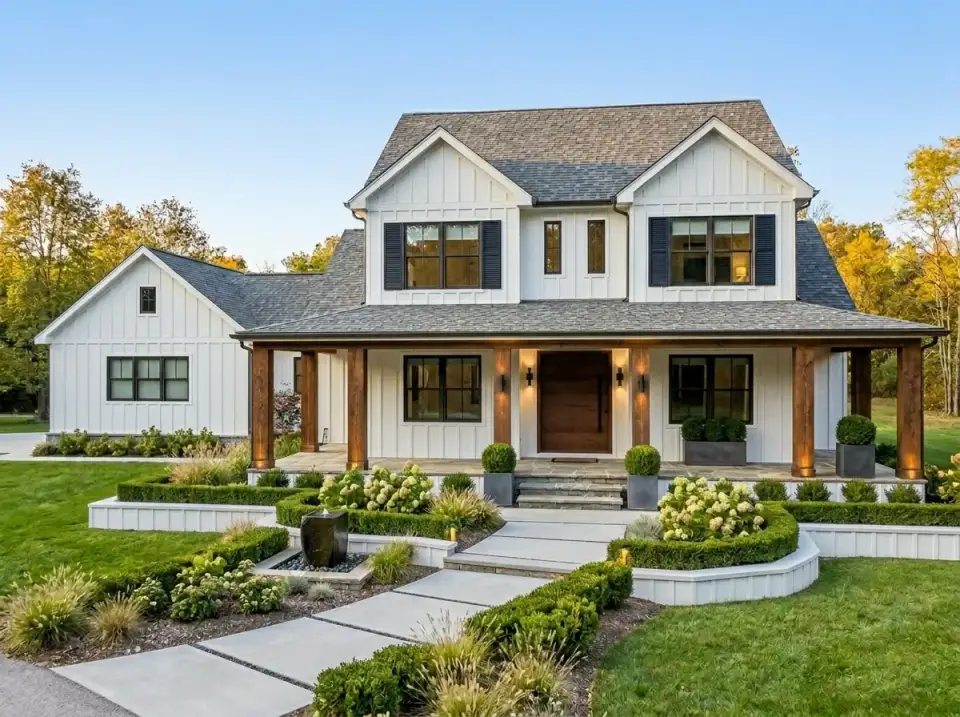 White farmhouse with rough-hewn timber porch posts, boxwood hedges, and structured paver front walk
