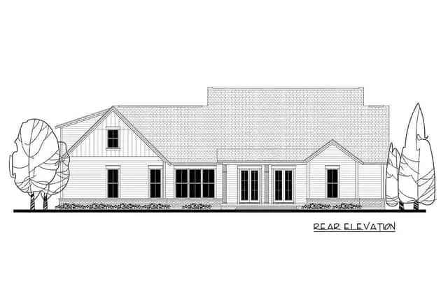 Evening exterior modern farmhouse with bonus room over garage